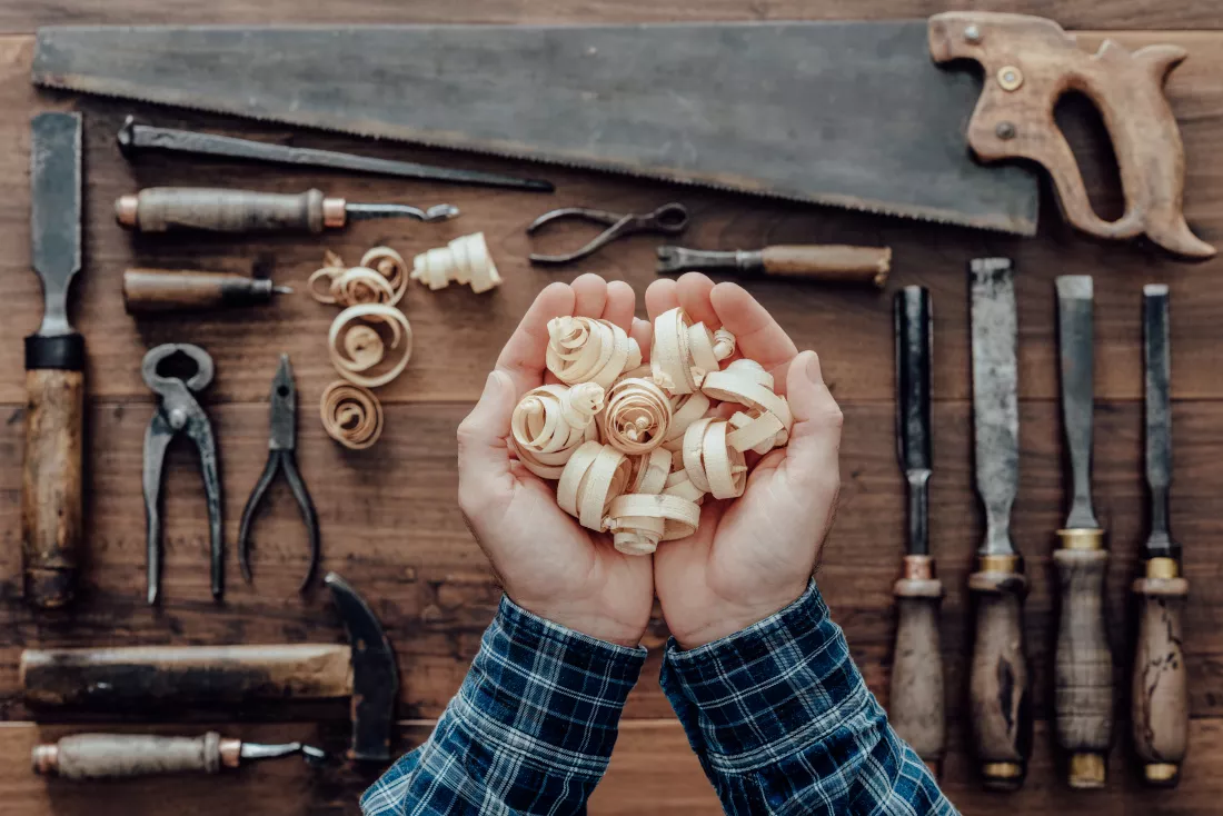 carpenter-holding-wood-shavings